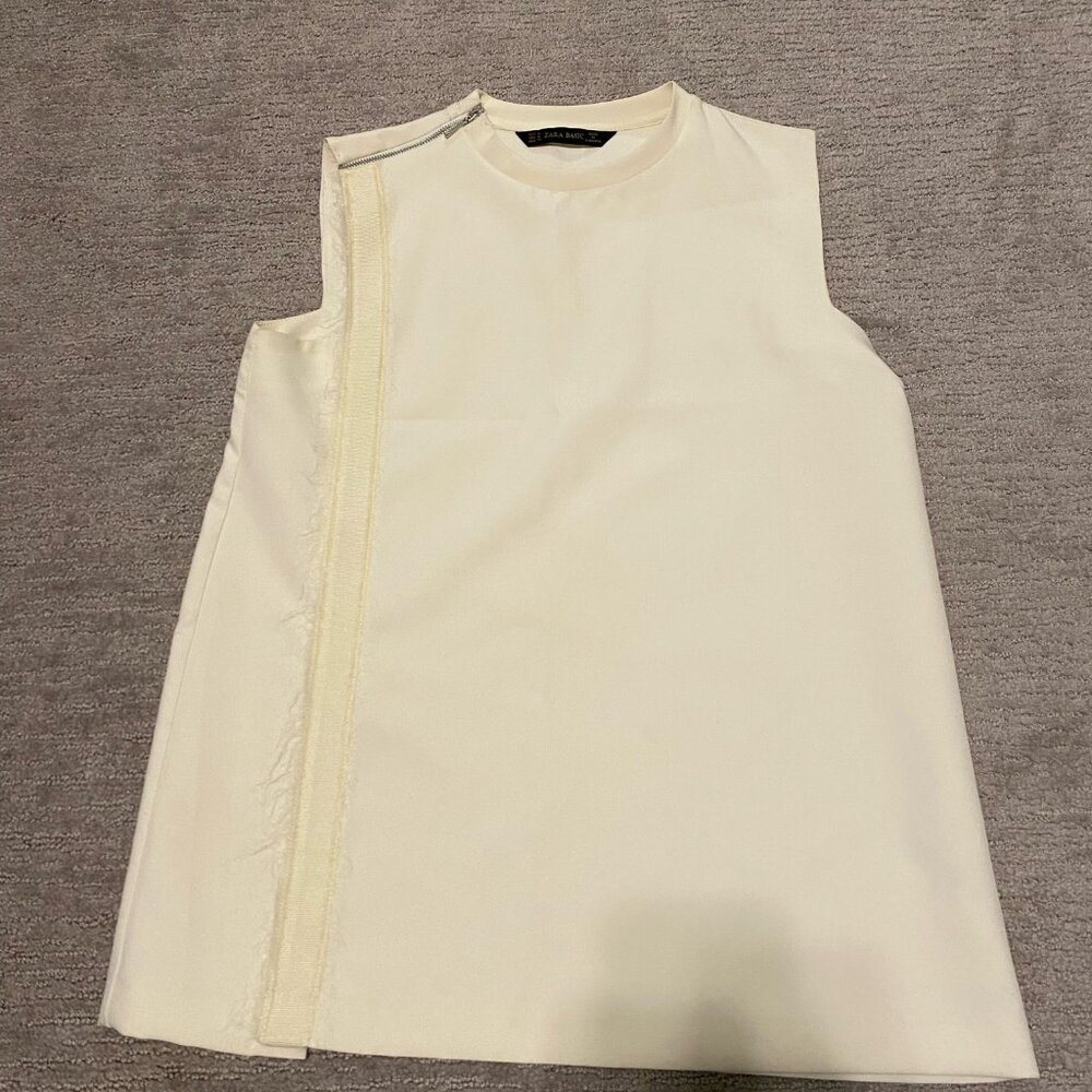 Sleeveless off-white silk blouse